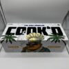 COOK'D 2G disposable vape, 1G pre-roll joint, and three THC gummies Juiced Edition cannabis bundle branded packaging.